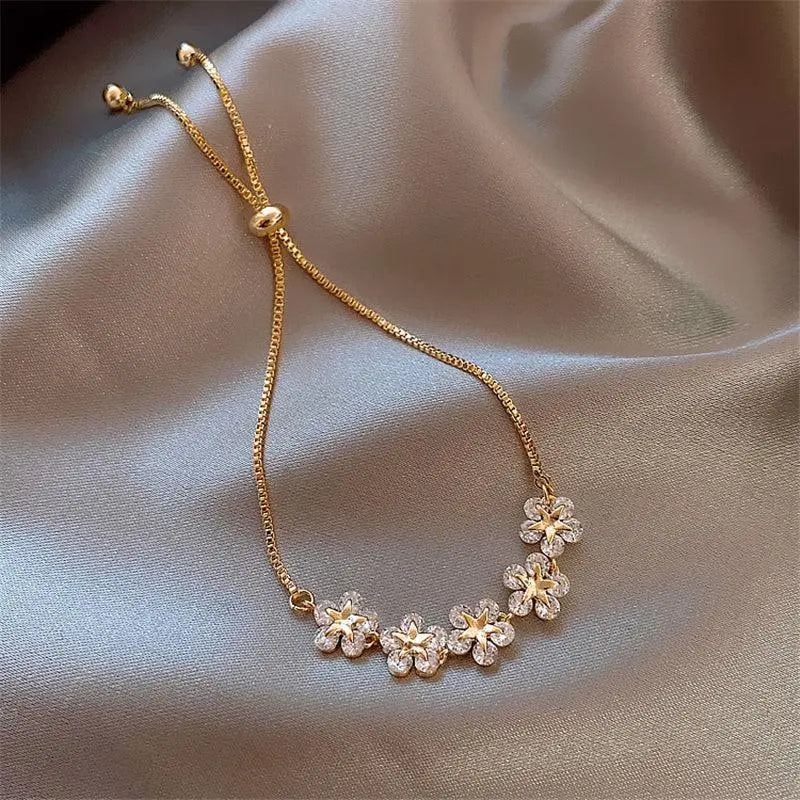 Pulseira de margaridas de cristal em cor de ouro